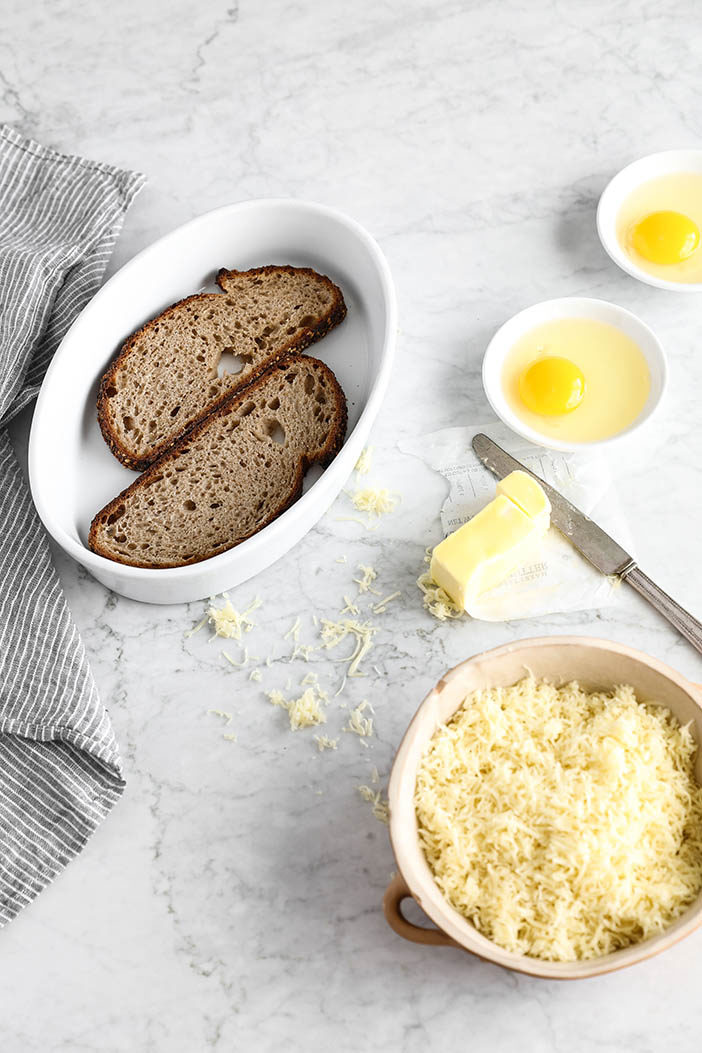 Start with some slices of bread, grated cheese and eggs