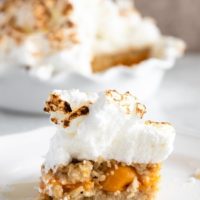 Baked rice pudding with apricots and topped with meringue