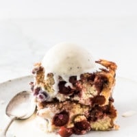 Cranberry upside-down cake with a scoop of vanilla ice cream