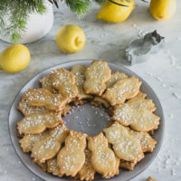 plate of lemon linzer cookies shaped like an owl