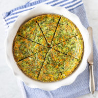 Baking dish with sliced, crustless carrot zucchini quiche