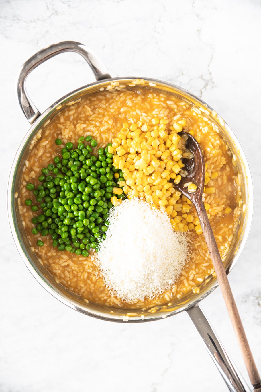 silver sautee pan with Spring Risotto With Peas and Corn