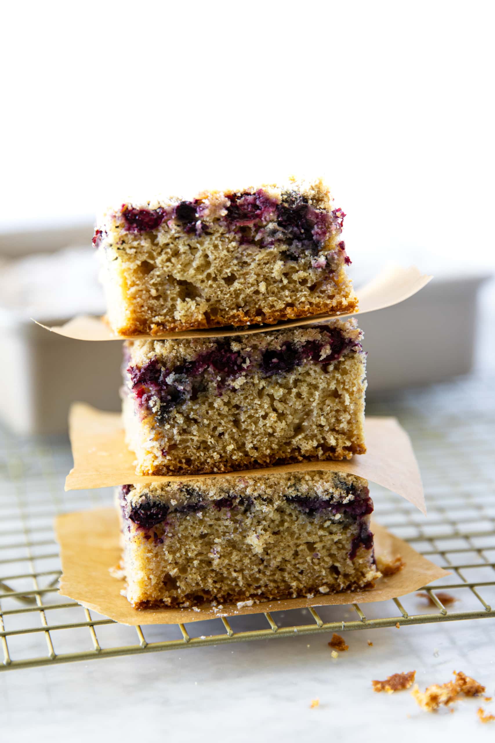 Three stacked slices of Blueberry Crumb Cake from verygoodcook.com