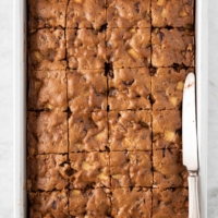 Baking pan with Apple Pecan Chocolate Coffee Cake, cut into slices | from verygoodcook.com